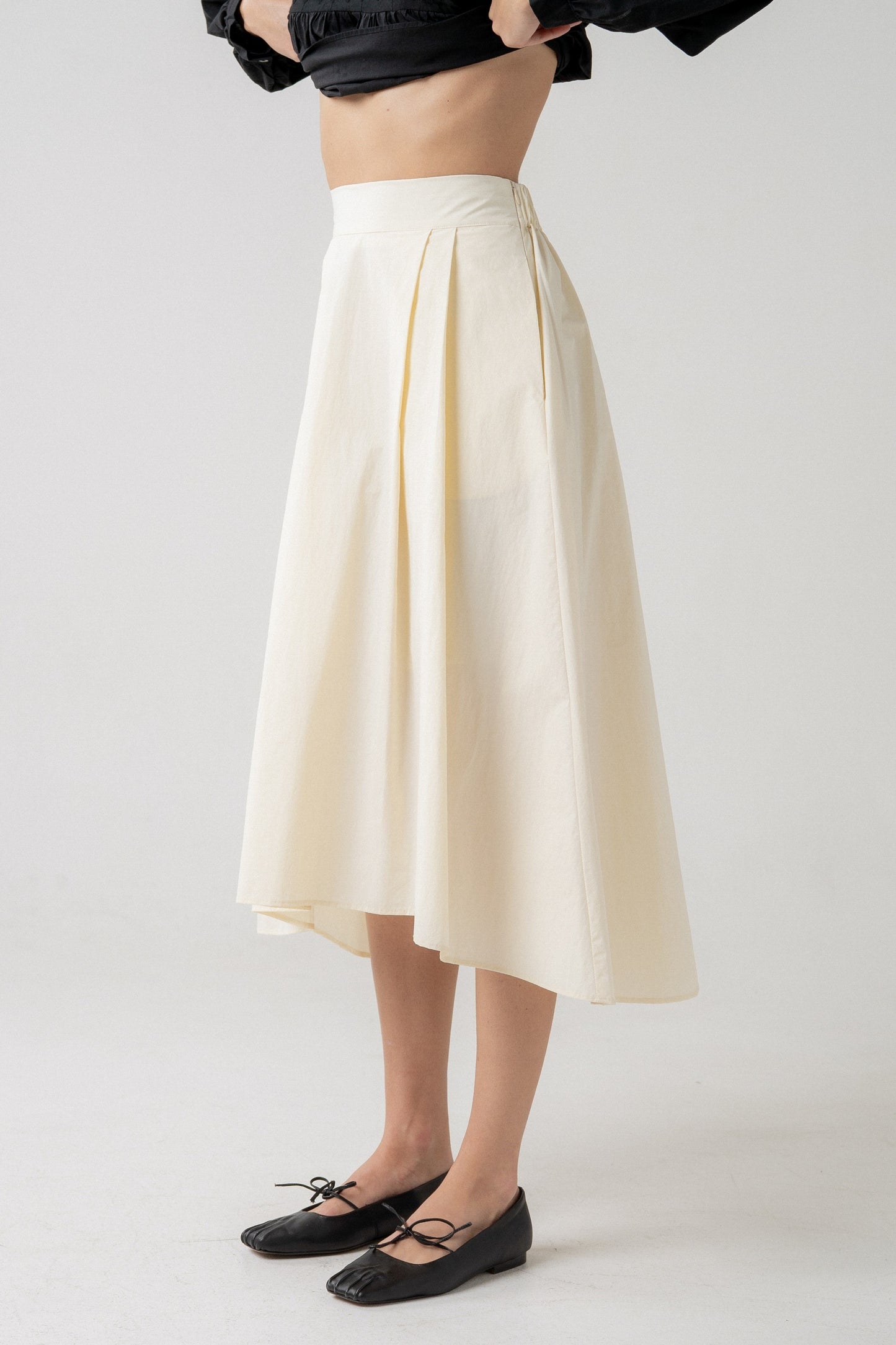 Pleated Midi Skirt With Asymmetrical Hem