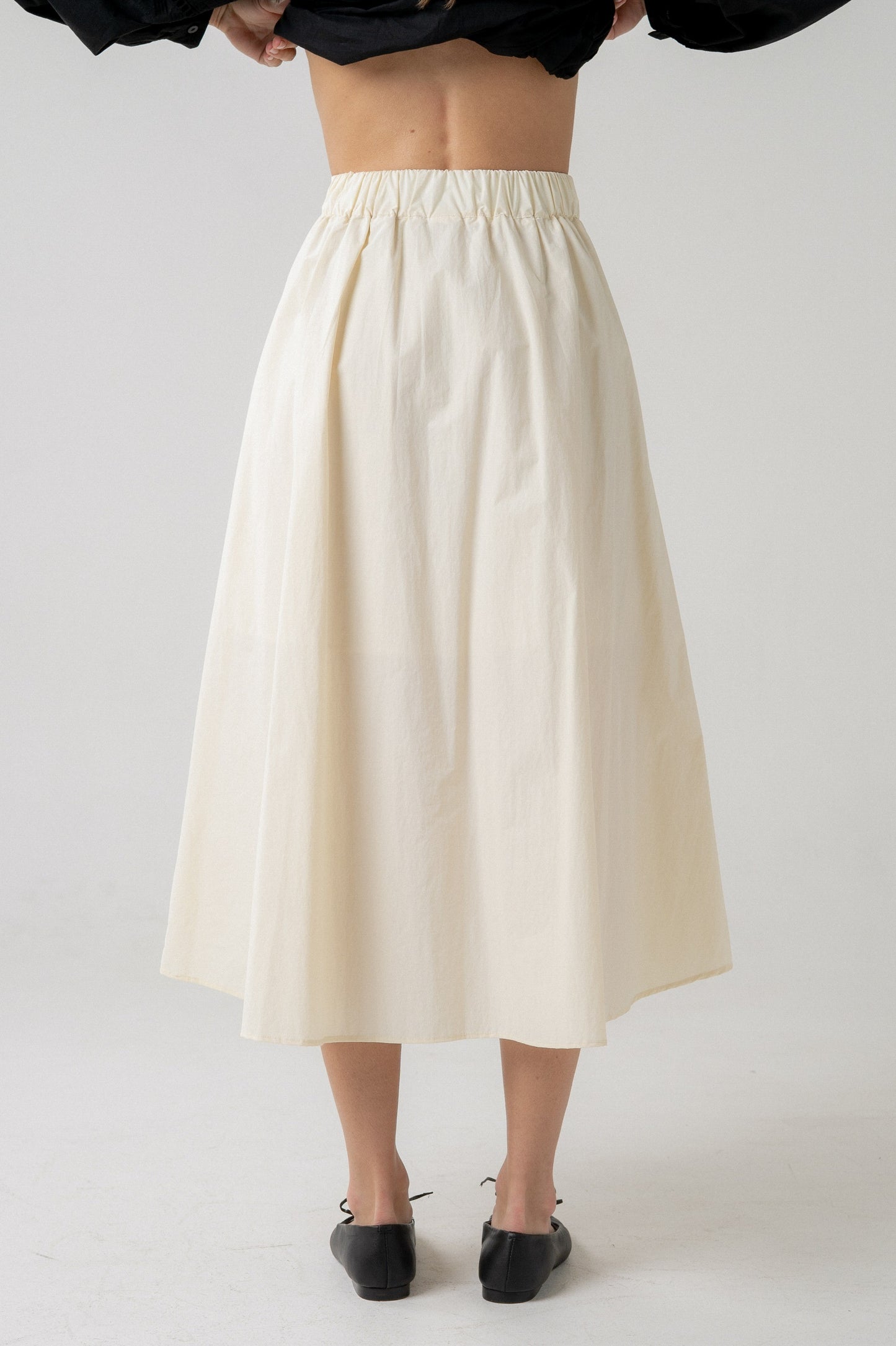 Pleated Midi Skirt With Asymmetrical Hem